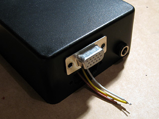 Pins used for monitor identification passed through hole in enclosure