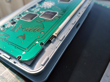 Photo of a the rubber strip installed inside the fold of the flat flex cable