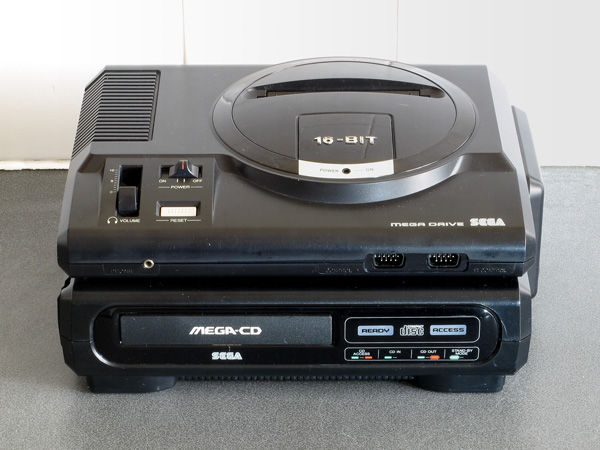 A Mega-CD console underneath a Mega Drive
