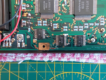 Photo of repaired circuit traces inside the PC-1500