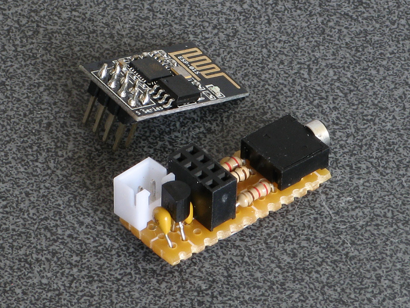 Photo of ESP-01S module next to the modem's assembled circuit board